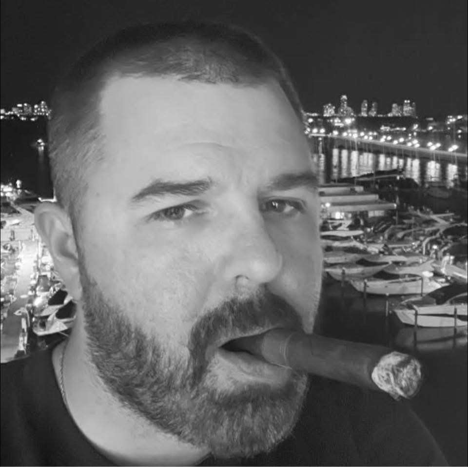 Peter Church, founder of Nip the Tip, enjoying a cigar